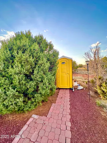 a view of a pathway with a park