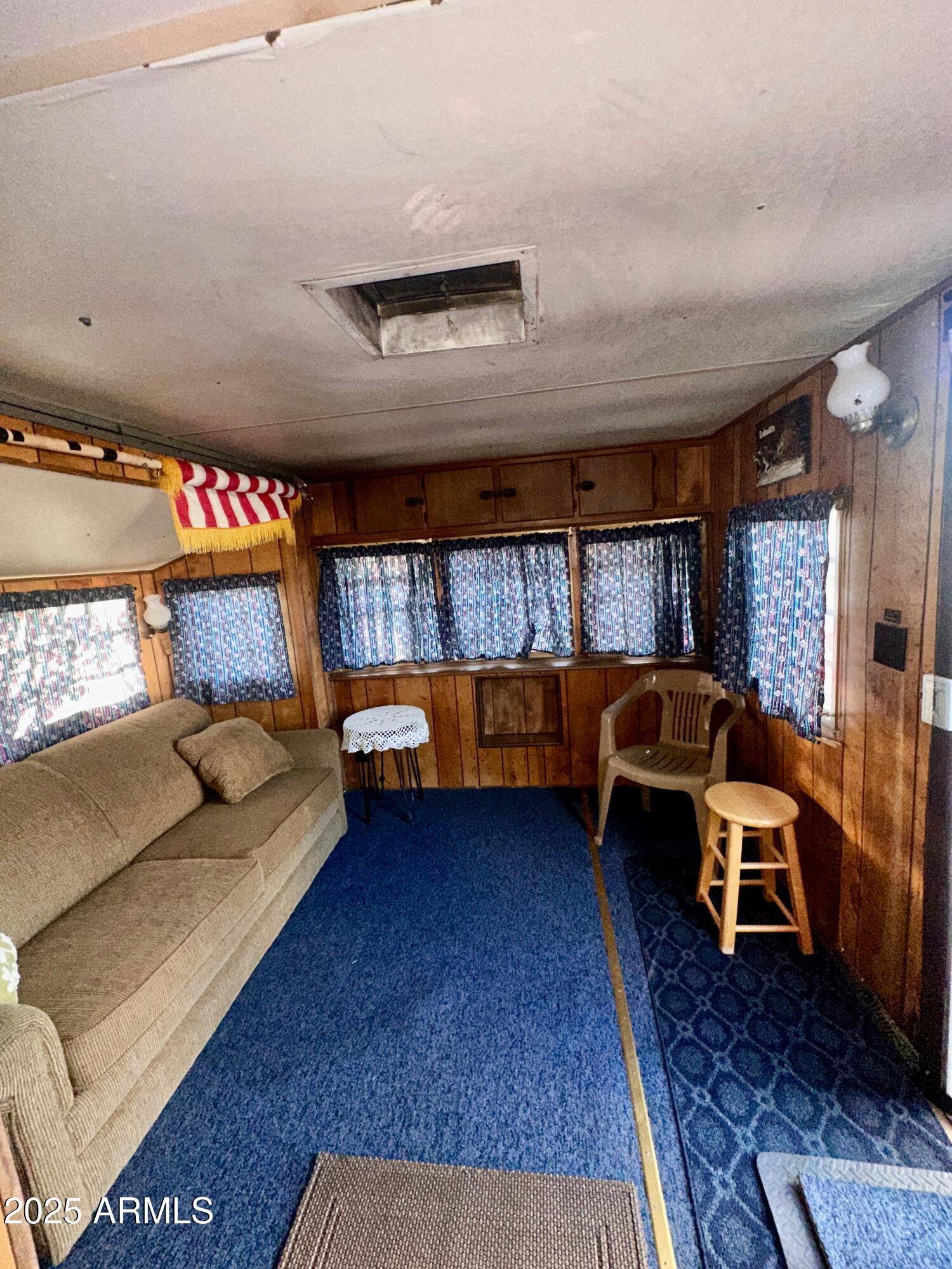 47 County Road, Unit 165 Show Low, AZ 85901 - Photo 14 of 30 a bedroom with furniture and a couch