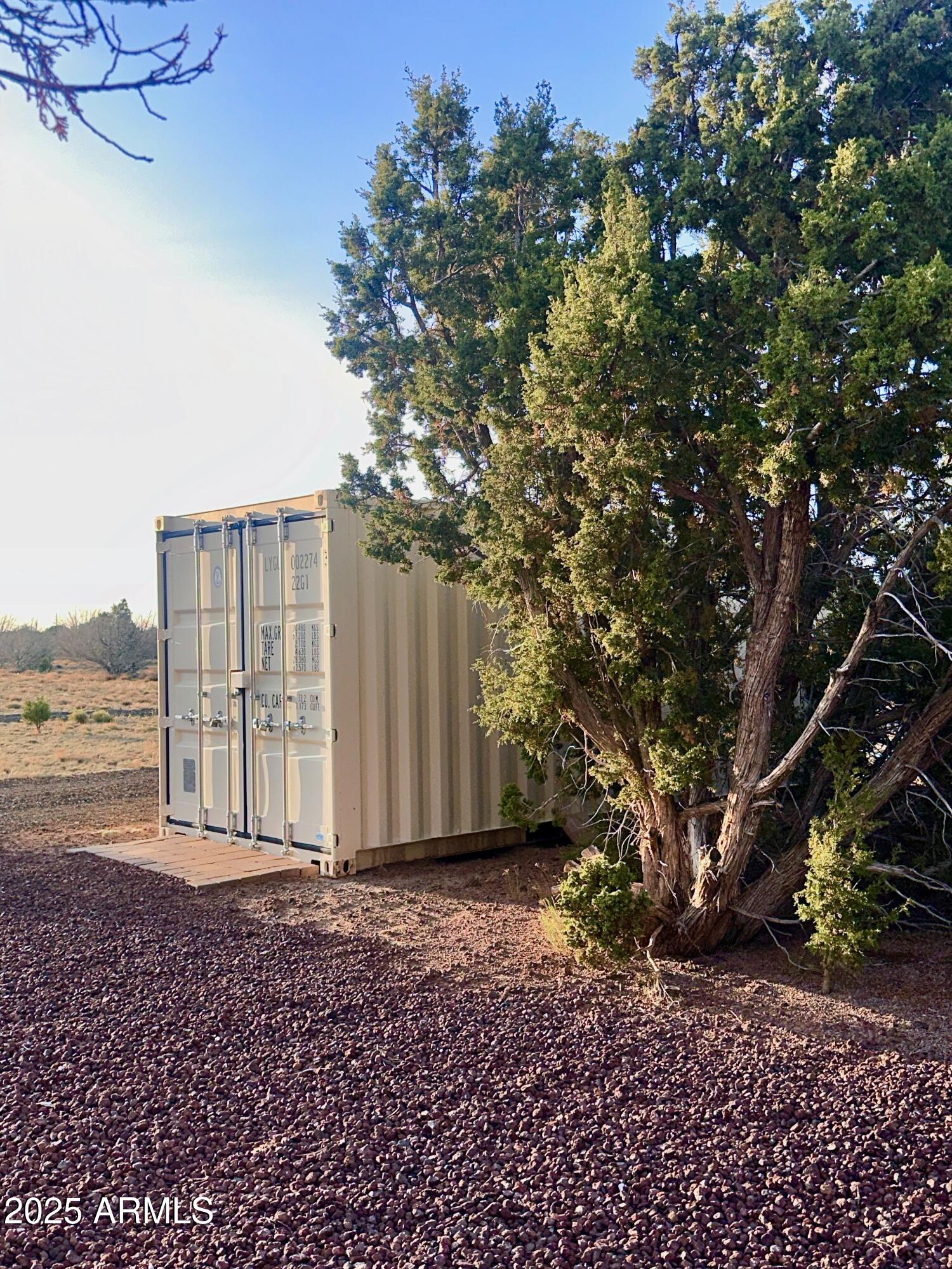 47 County Road, Unit 165 Show Low, AZ 85901 - Photo 18 of 30 a view of a house with backyard and trees