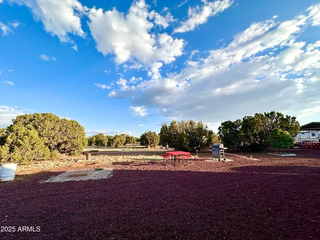 a view of a lake with a yard