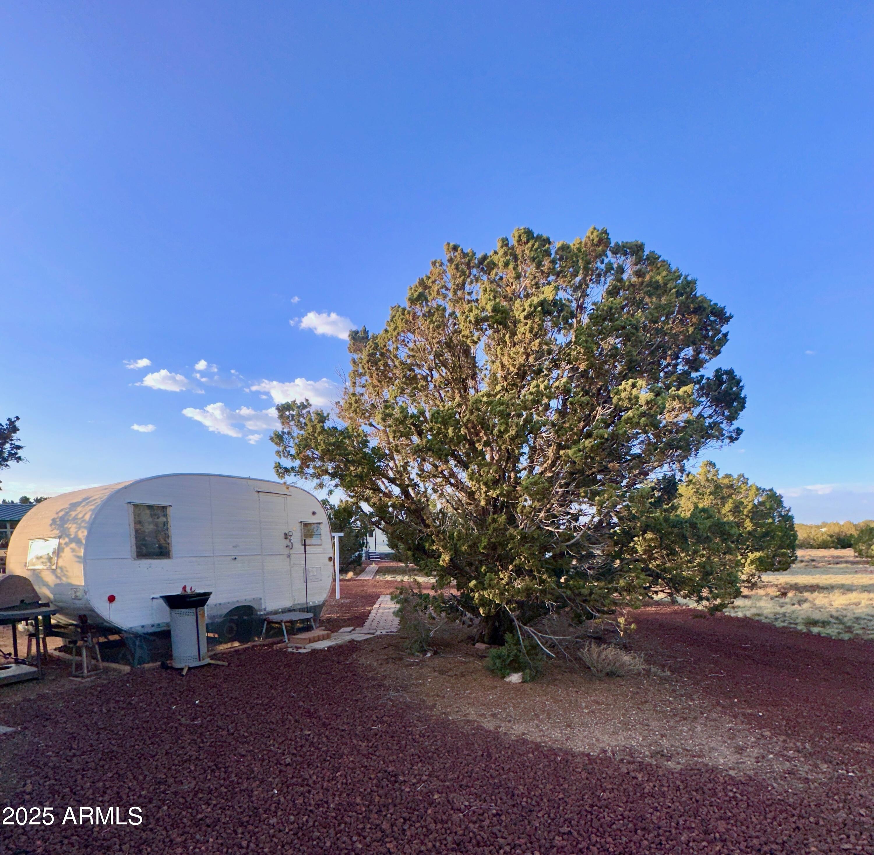 47 County Road, Unit 165 Show Low, AZ 85901 - Photo 24 of 30 a view of a couches under an umbrella