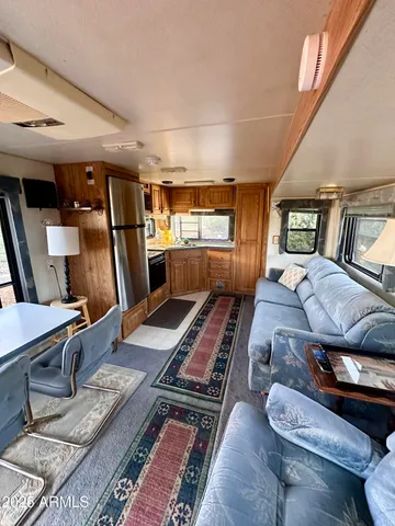 a living room with furniture flat screen tv and a fireplace