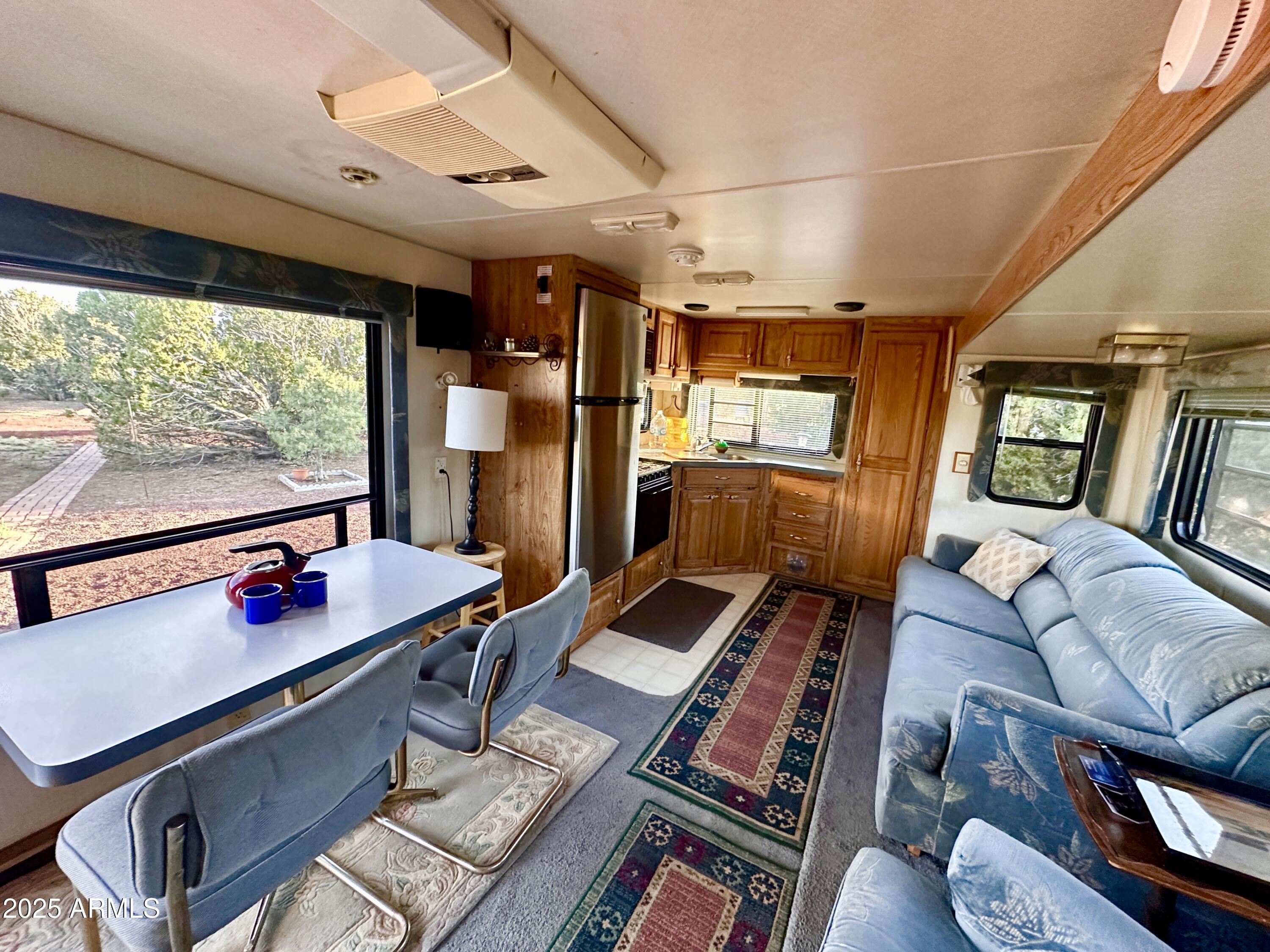 47 County Road, Unit 165 Show Low, AZ 85901 - Photo 7 of 30 a living room with furniture rug and wooden floor