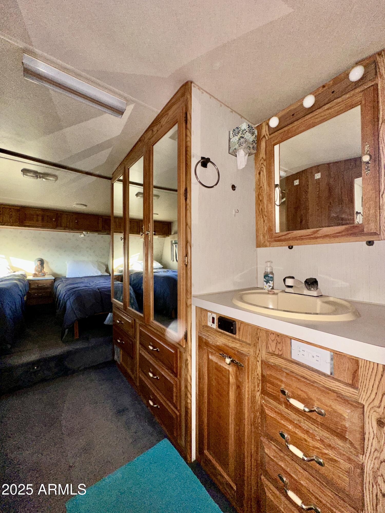 47 County Road, Unit 165 Show Low, AZ 85901 - Photo 9 of 30 a bathroom with a sink double vanity and a mirror