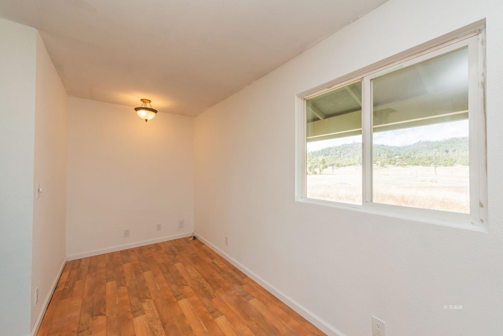 1095 Hyampom Road Hayfork, CA 96041 - Photo 17 of 41 an empty room with a window