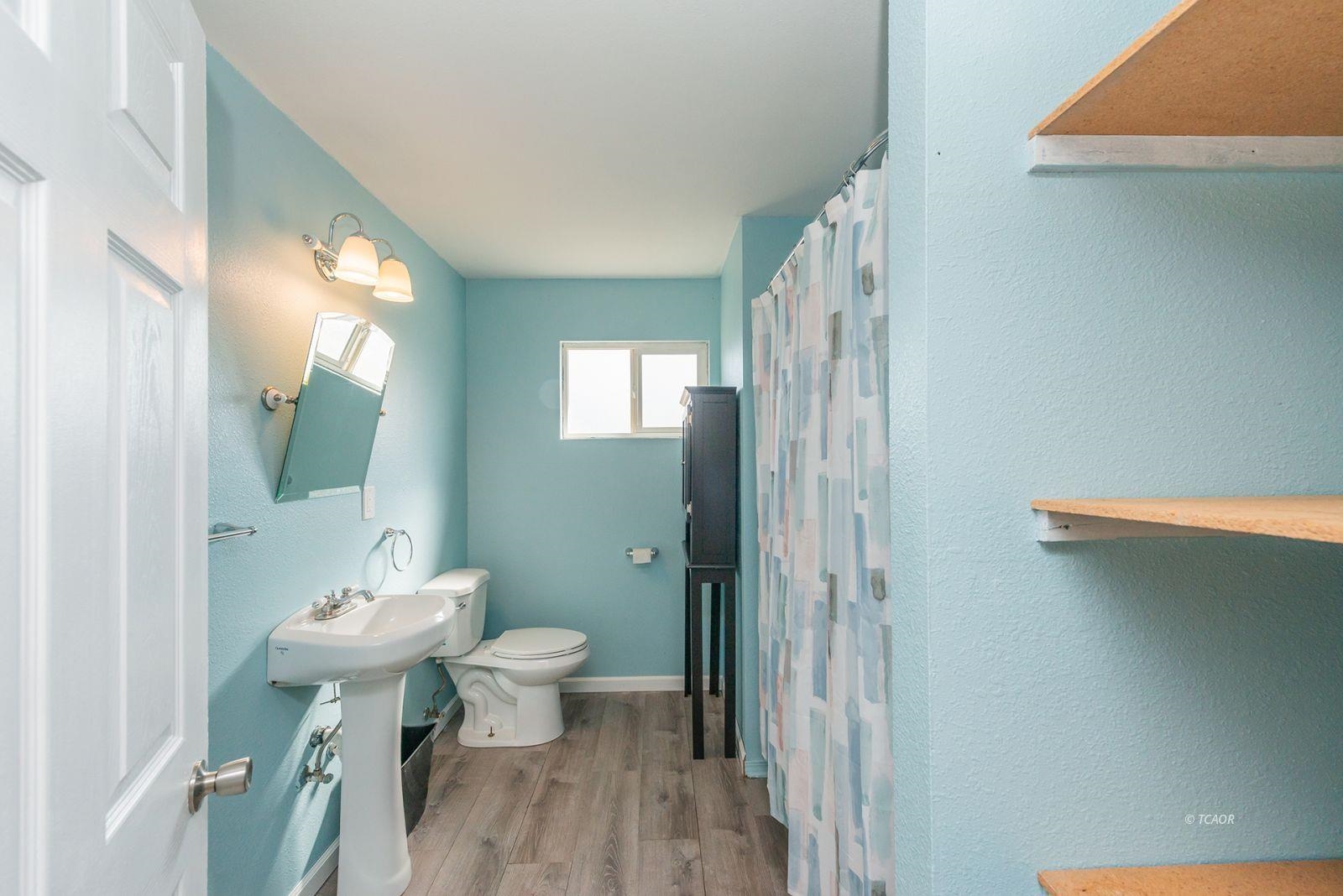 1095 Hyampom Road Hayfork, CA 96041 - Photo 18 of 41 a bathroom with a sink a toilet and shower