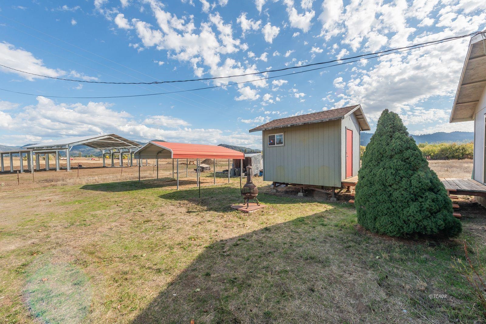 1095 Hyampom Road Hayfork, CA 96041 - Photo 23 of 41 a view of a house with a yard