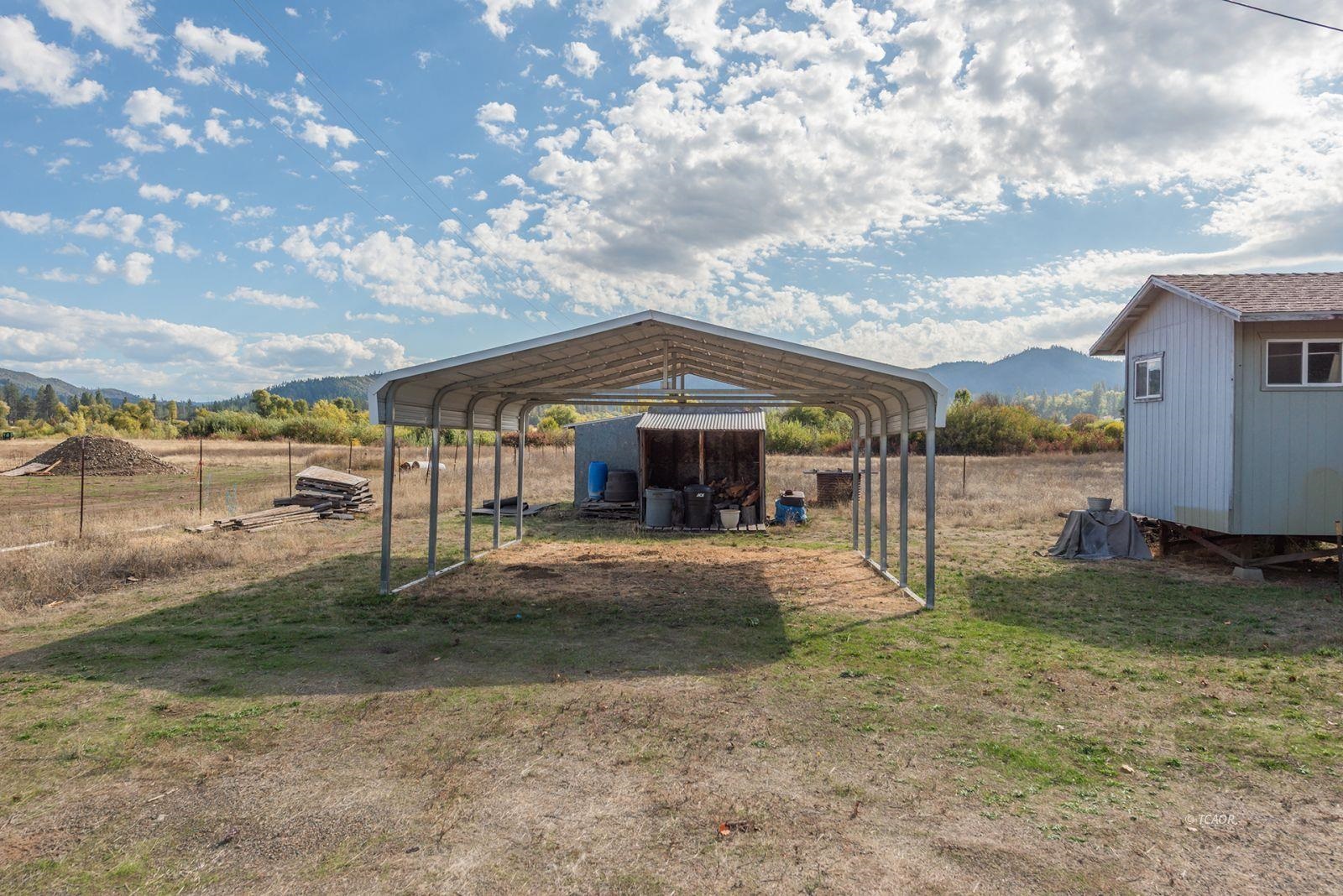 1095 Hyampom Road Hayfork, CA 96041 - Photo 24 of 41 a backyard of a house with table and chairs