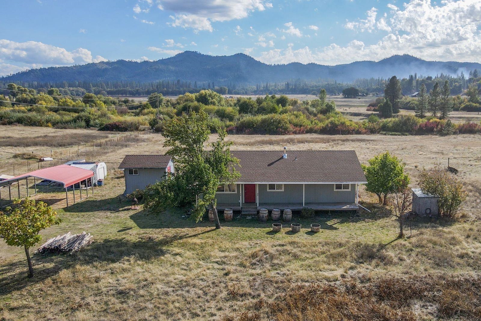 1095 Hyampom Road Hayfork, CA 96041 - Photo 27 of 41 an aerial view of a house with a garden