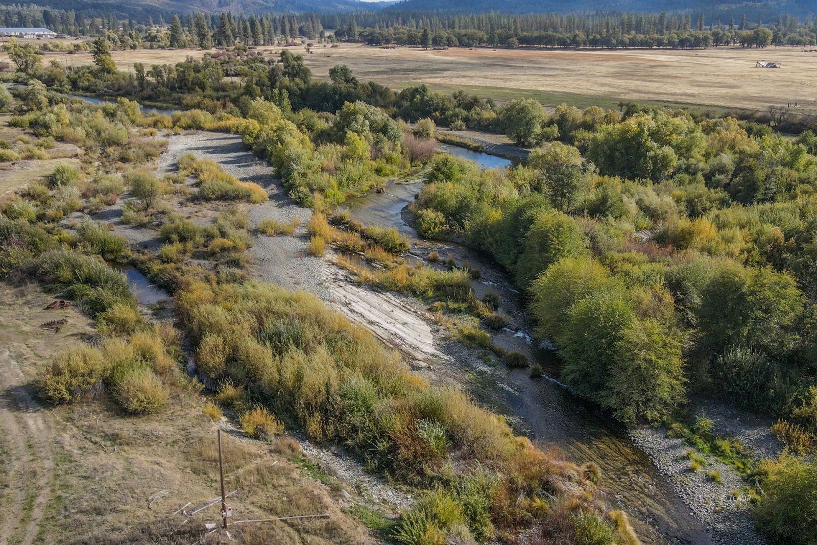 1095 Hyampom Road Hayfork, CA 96041 - Photo 30 of 41 a view of a lake with beach and green space