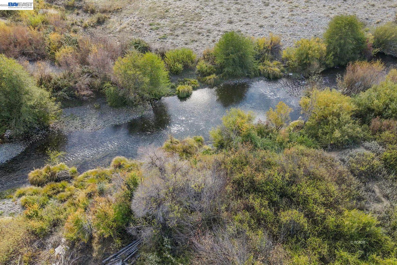 1095 Hyampom Road Hayfork, CA 96041 - Photo 3 of 41 a view of a lake with lots of trees