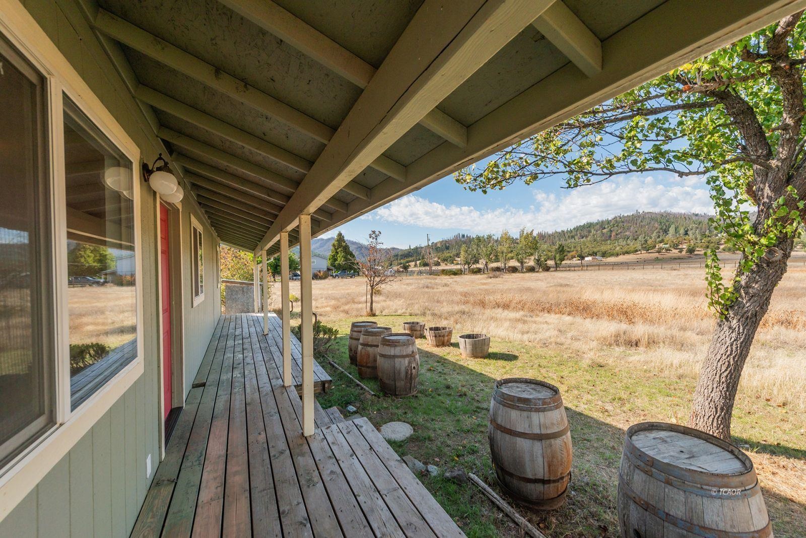 1095 Hyampom Road Hayfork, CA 96041 - Photo 33 of 41 a view of a balcony with chair and wooden floor