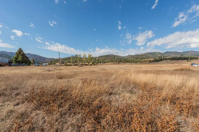 a view of an ocean and a mountain