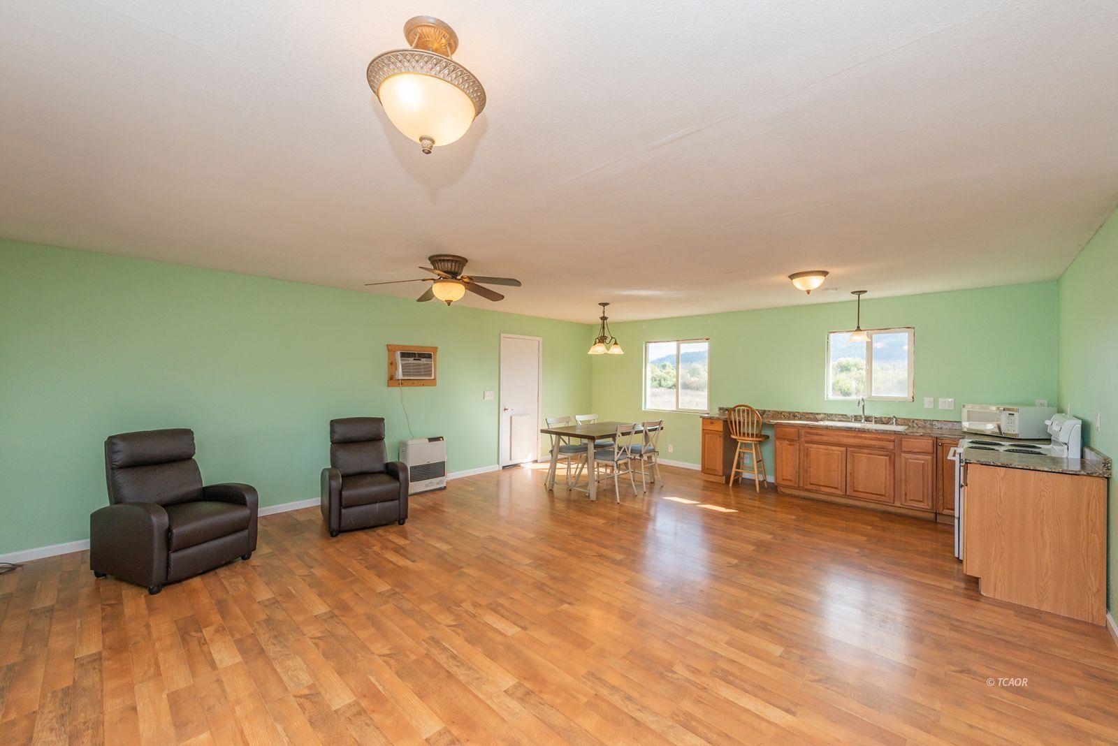 1095 Hyampom Road Hayfork, CA 96041 - Photo 5 of 41 a living room with furniture and a wooden floor