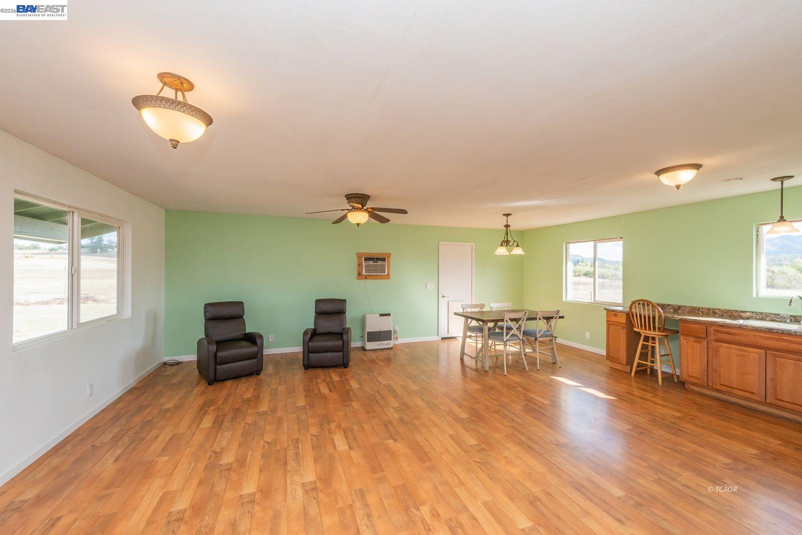 1095 Hyampom Road Hayfork, CA 96041 - Photo 6 of 41 a view of a dining room with furniture window and wooden floor