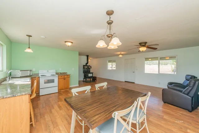 a dining room with a table and chairs