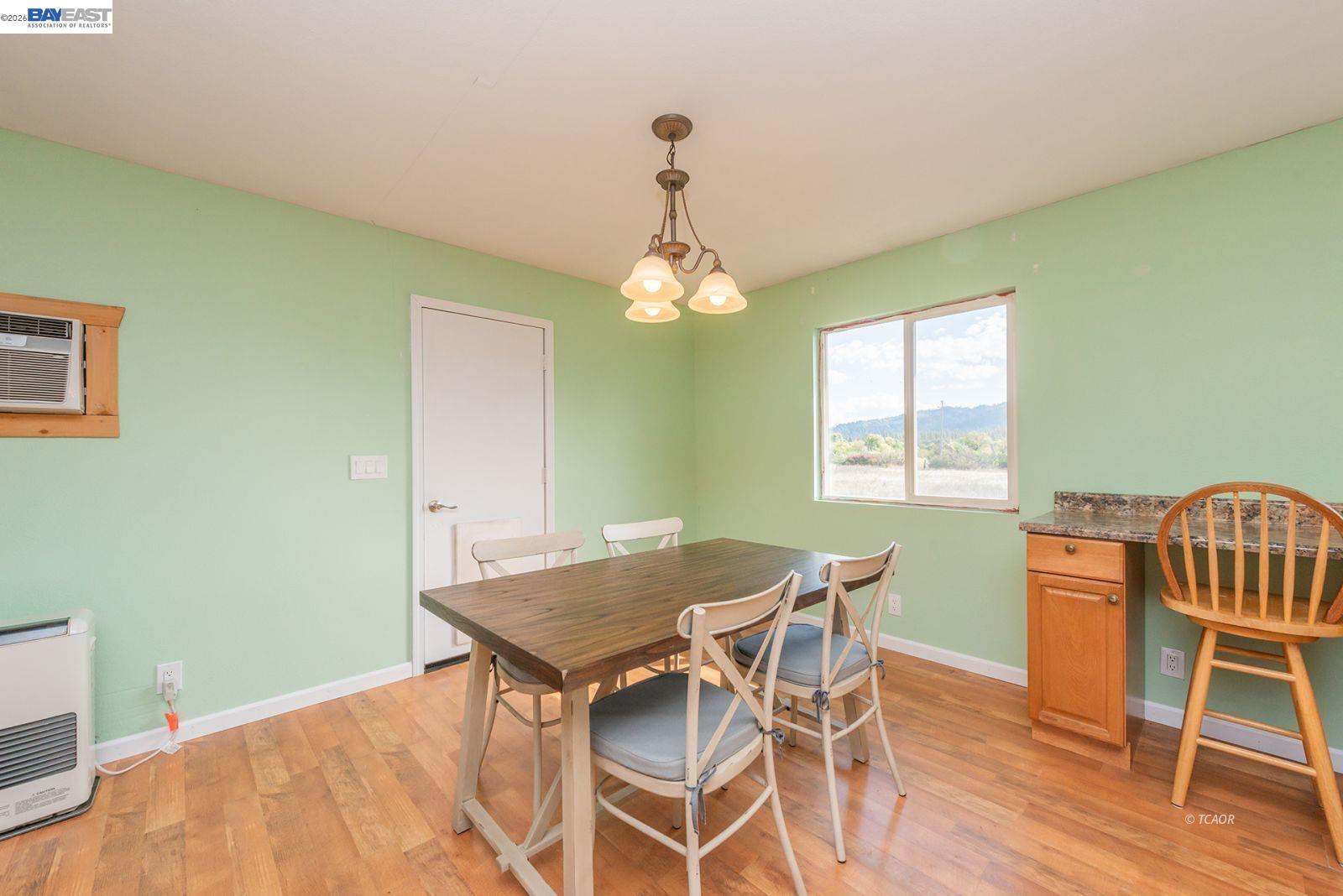 1095 Hyampom Road Hayfork, CA 96041 - Photo 10 of 41 a view of a dining room with furniture and wooden floor