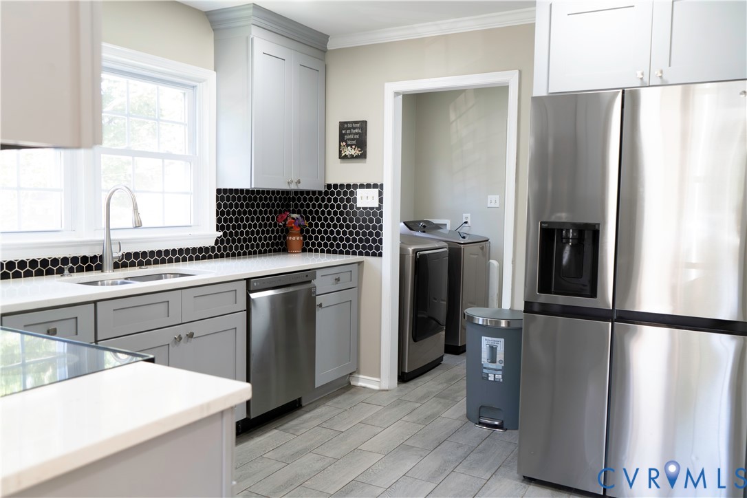 2718 Stacie Road Richmond, VA 23224 - Photo 10 of 50 Modern kitchen featuring light gray cabinetry, whi