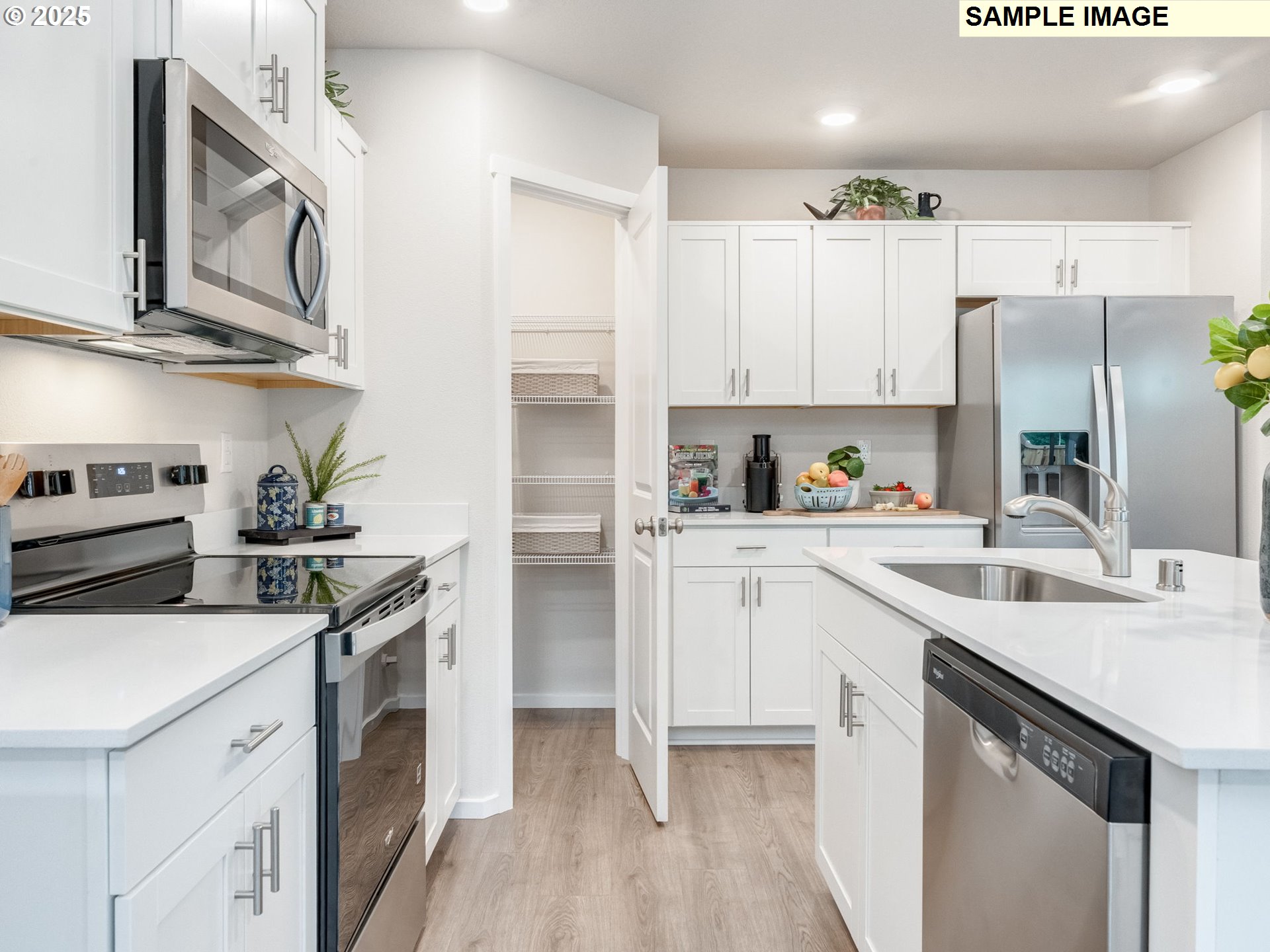 1207 Southeast 194th Place Camas, WA 98607 - Photo 6 of 24 a kitchen with stainless steel appliances granite countertop a sink stove refrigerator and cabinets