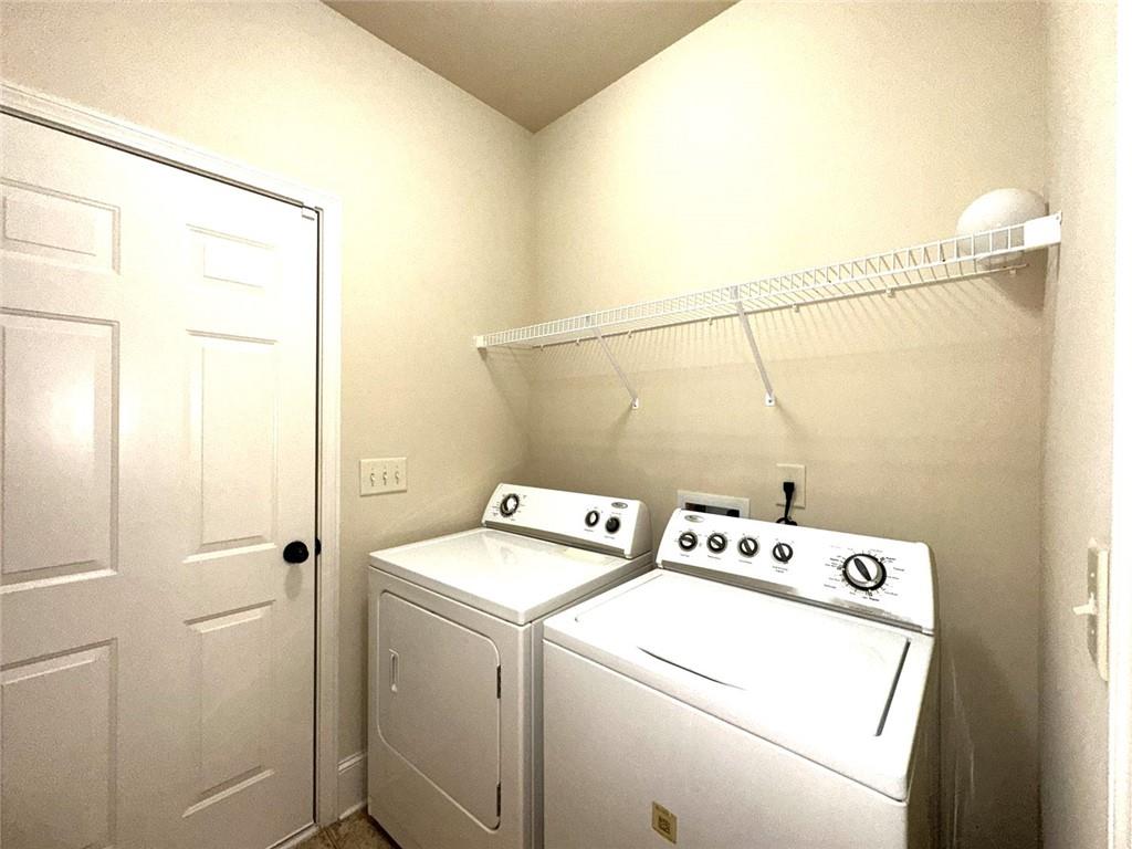 1365 Delo Lane Cumming, GA 30041 - Photo 17 of 43 a utility room with dryer and washer