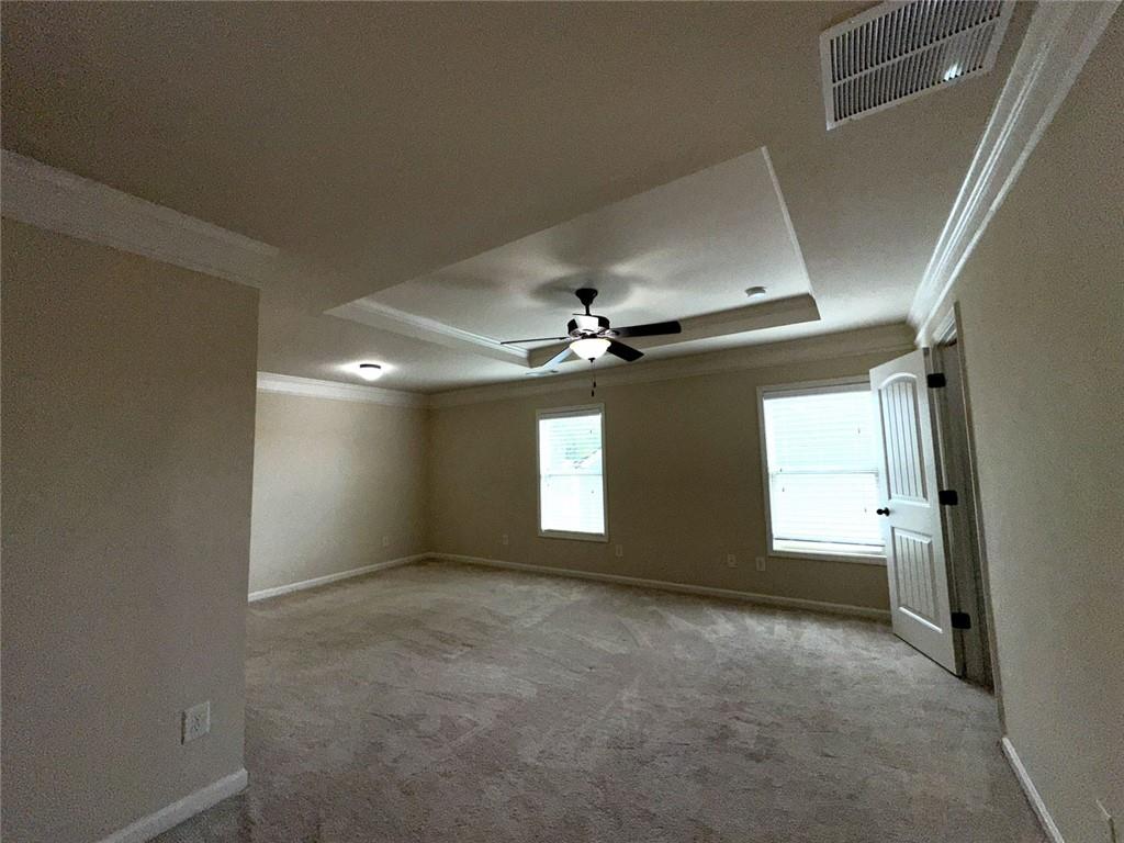 1365 Delo Lane Cumming, GA 30041 - Photo 20 of 43 an empty room with windows and chandelier