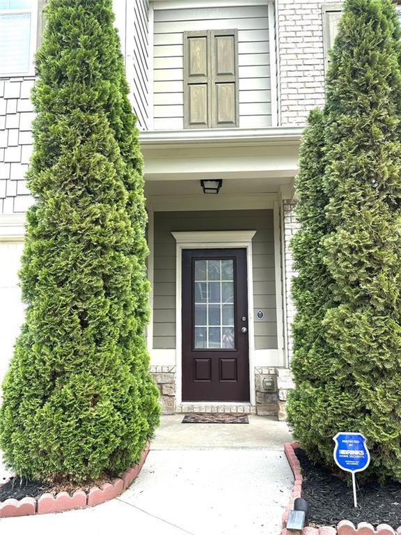 1365 Delo Lane Cumming, GA 30041 - Photo 2 of 43 a front view of a house with a yard