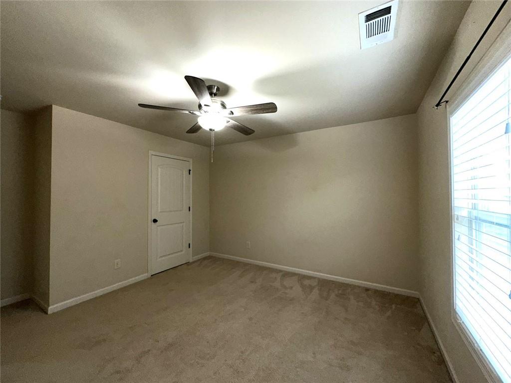 1365 Delo Lane Cumming, GA 30041 - Photo 30 of 43 an empty room with a window