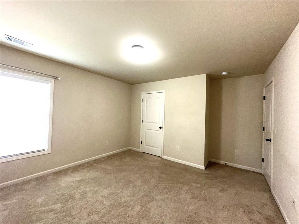 1365 Delo Lane Cumming, GA 30041 - Photo 31 of 43 an empty room with windows