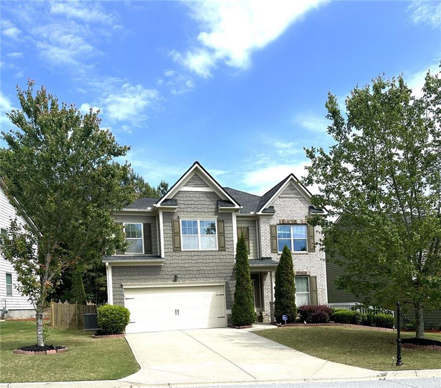 1365 Delo Lane Cumming, GA 30041 - Photo 43 of 43 a front view of a house with a yard