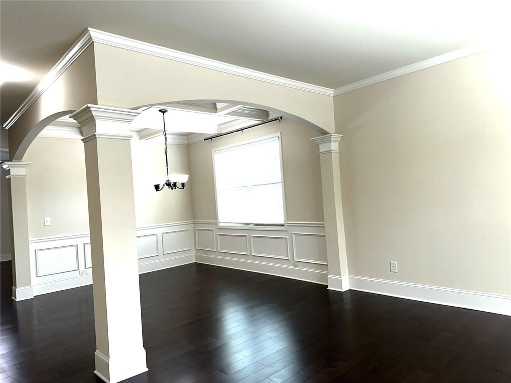 1365 Delo Lane Cumming, GA 30041 - Photo 5 of 43 an empty room with wooden floor and windows