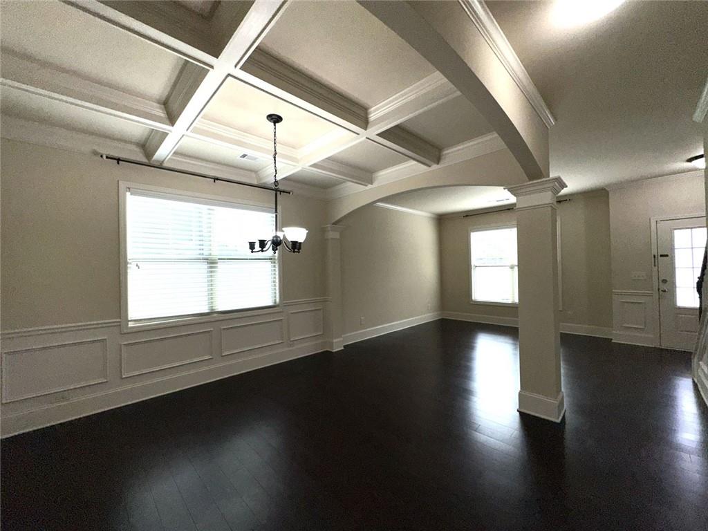 1365 Delo Lane Cumming, GA 30041 - Photo 6 of 43 a view of an empty room with wooden floor and a window