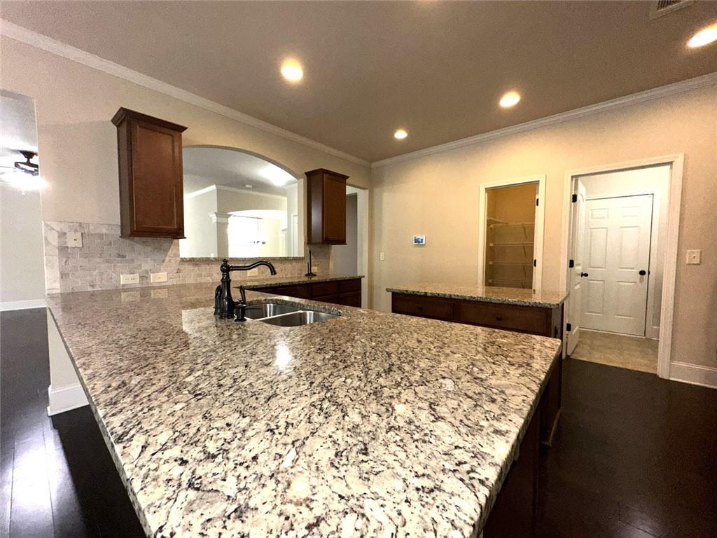 1365 Delo Lane Cumming, GA 30041 - Photo 10 of 43 a view of kitchen and sink
