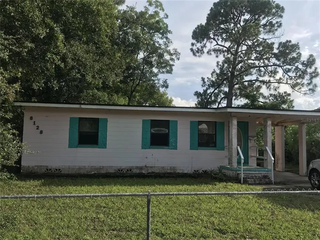 a house with trees in the background