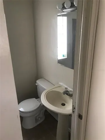 a bathroom with a sink and a toilet