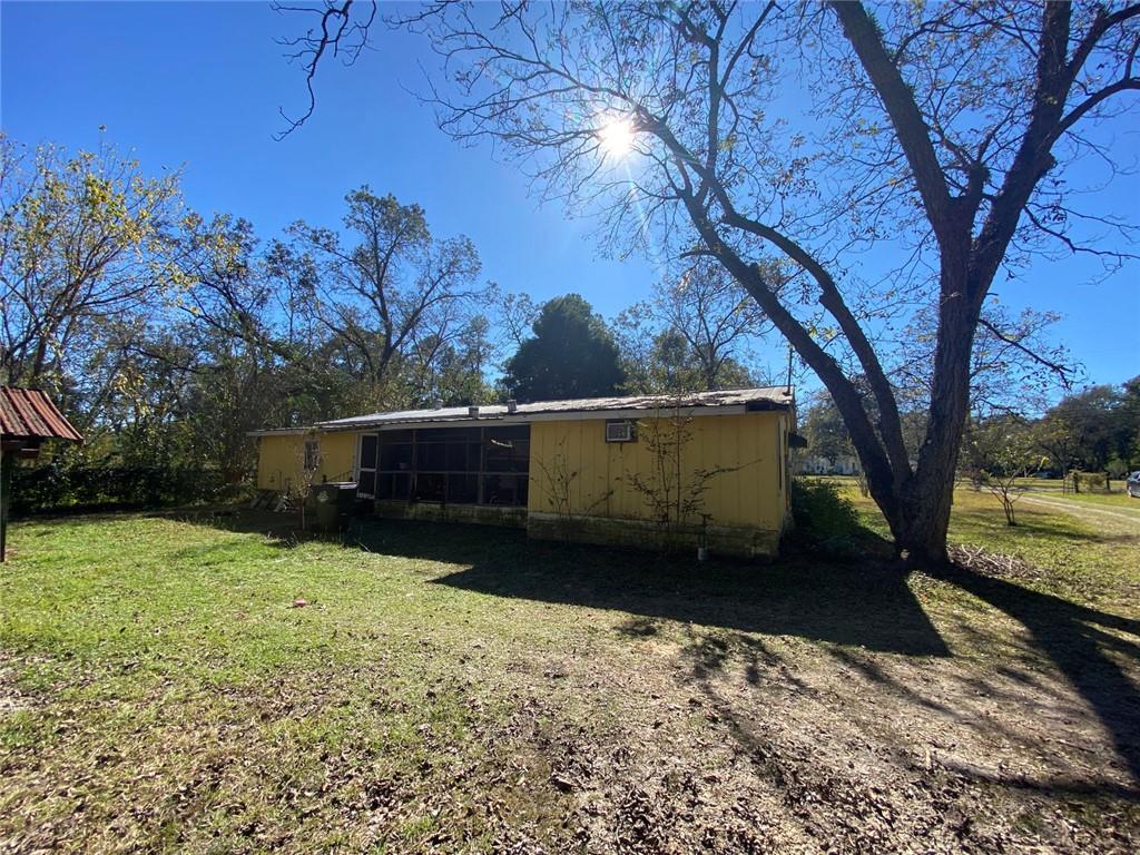 320 Old Perry Road Marshallville, GA 31057 - Photo 3 of 10 a view of a yard with an trees