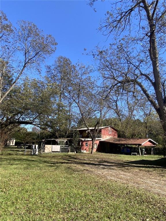 320 Old Perry Road Marshallville, GA 31057 - Photo 4 of 70 a front view of a house with a yard