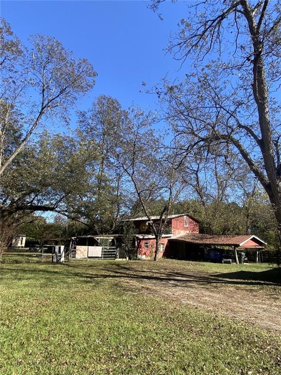 320 Old Perry Road Marshallville, GA 31057 - Photo 4 of 10 a front view of a house with a yard