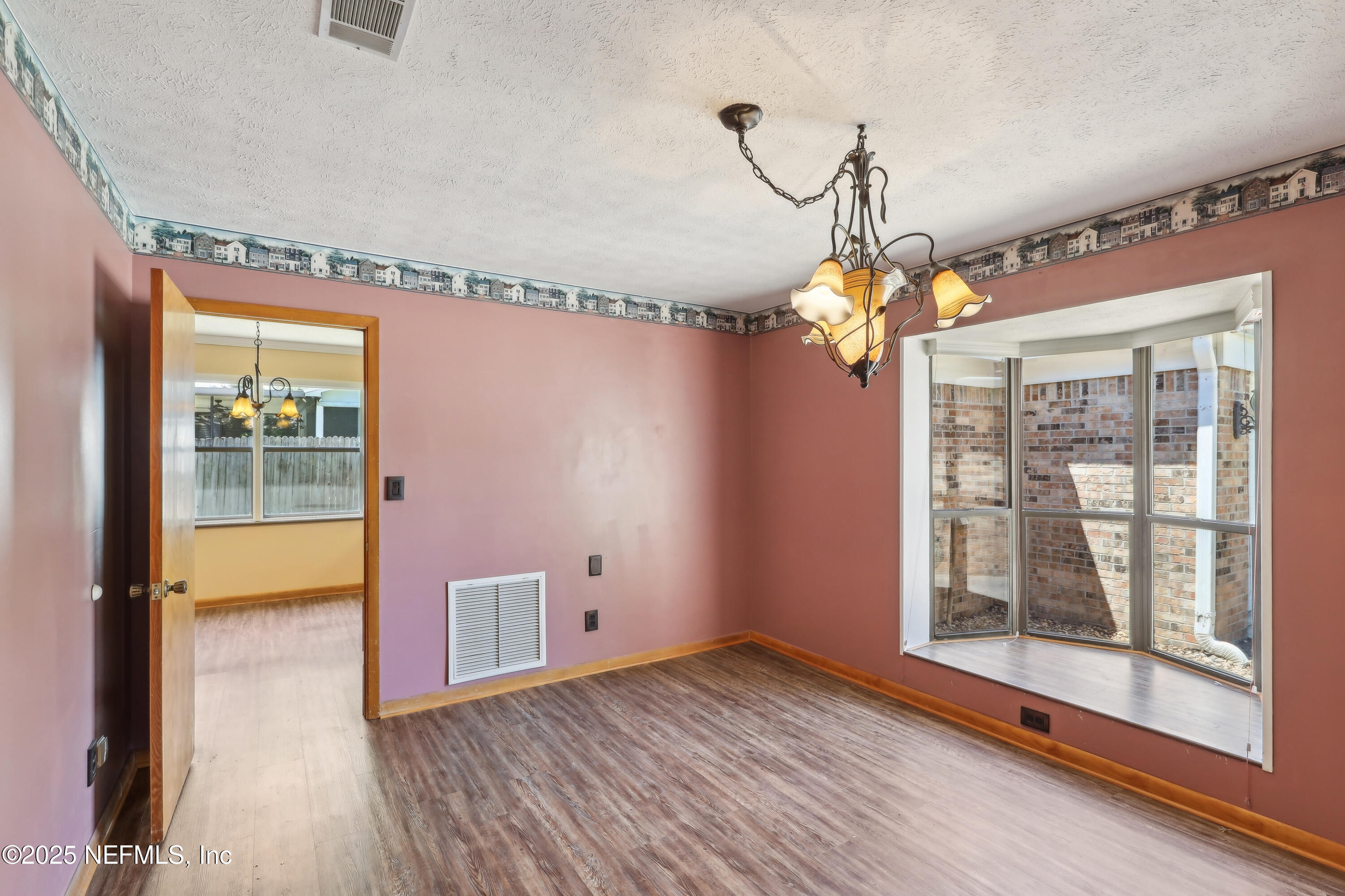 1071 Orangewood Road St. Johns, FL 32259 - Photo 11 of 56 a view of livingroom with hardwood floor and window