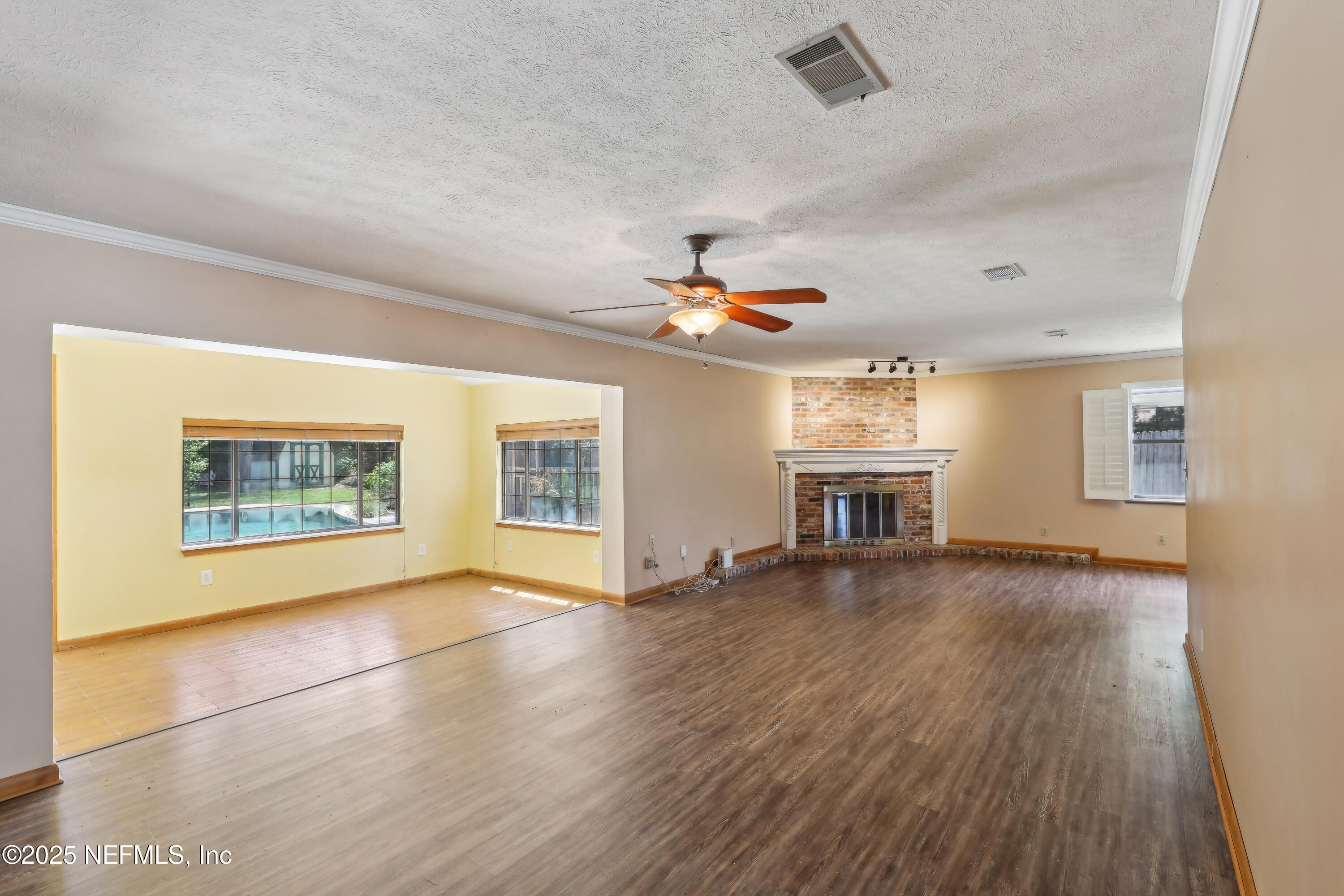 1071 Orangewood Road St. Johns, FL 32259 - Photo 14 of 56 a view of an empty room with window and wooden floor