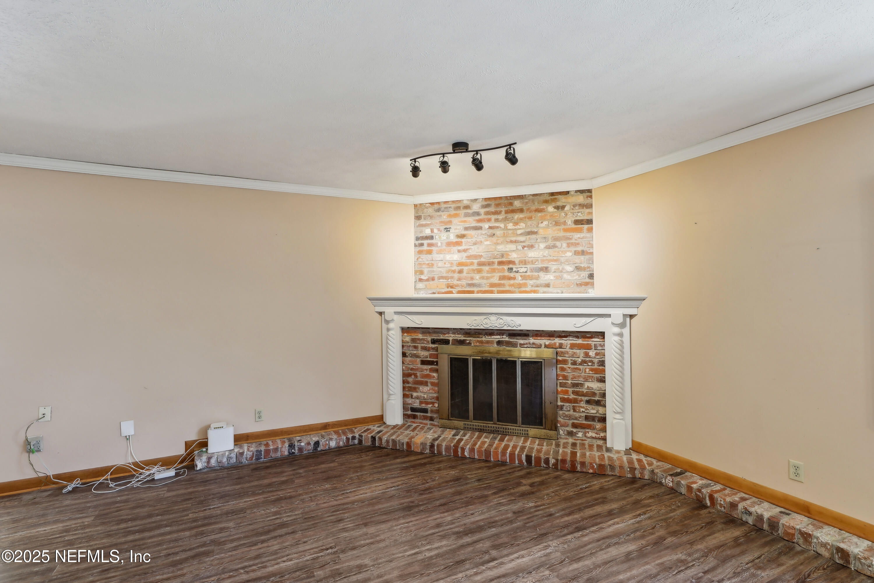 1071 Orangewood Road St. Johns, FL 32259 - Photo 16 of 56 a view of a livingroom with wooden floor and a fireplace