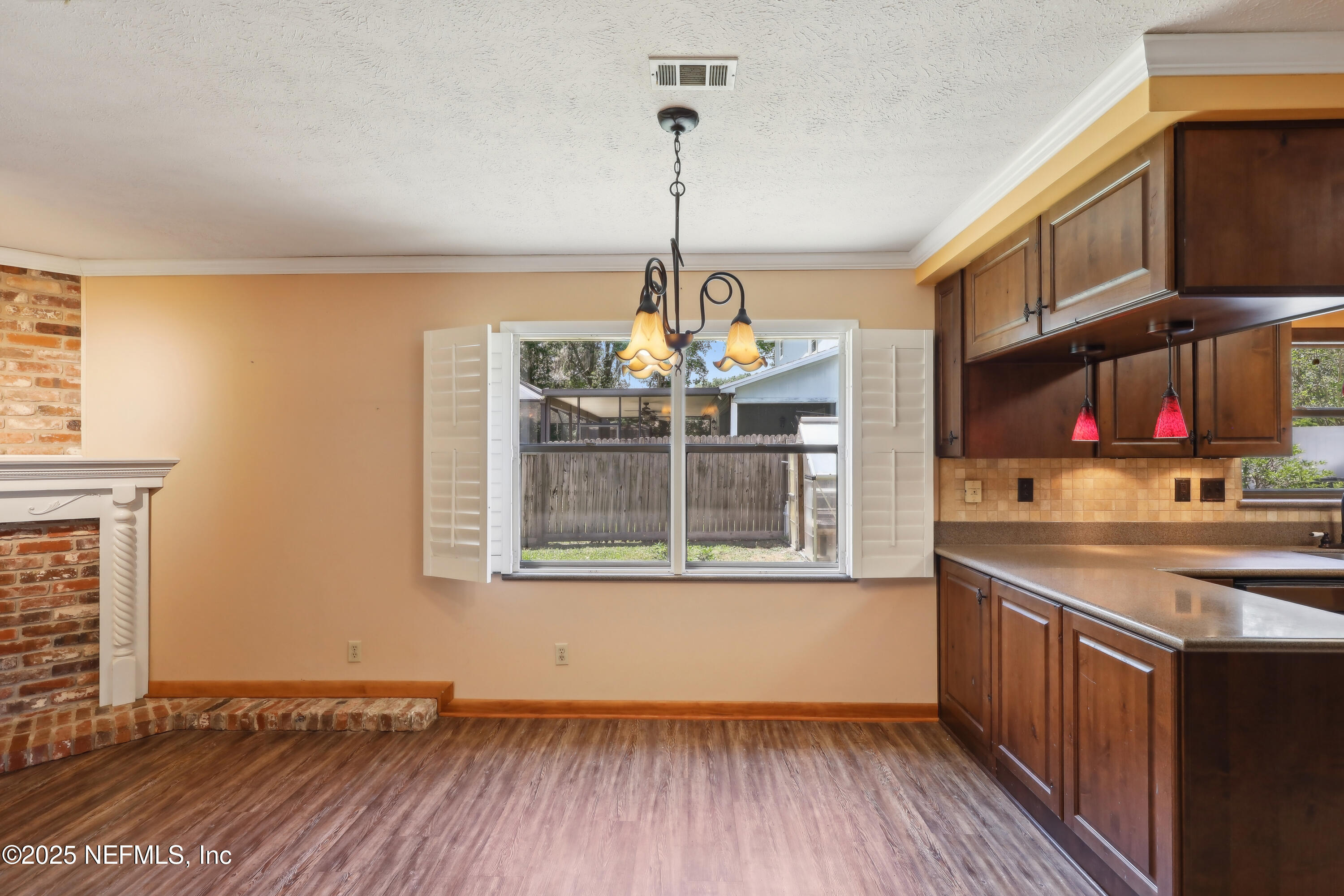 1071 Orangewood Road St. Johns, FL 32259 - Photo 18 of 56 a kitchen with stainless steel appliances granite countertop a stove and a wooden floors