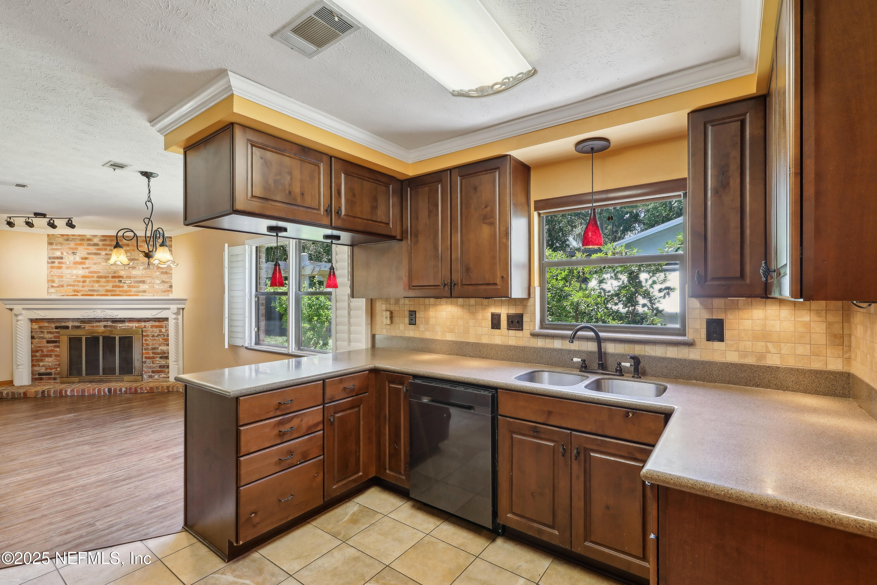 1071 Orangewood Road St. Johns, FL 32259 - Photo 20 of 56 a kitchen with a sink cabinets appliances and a window