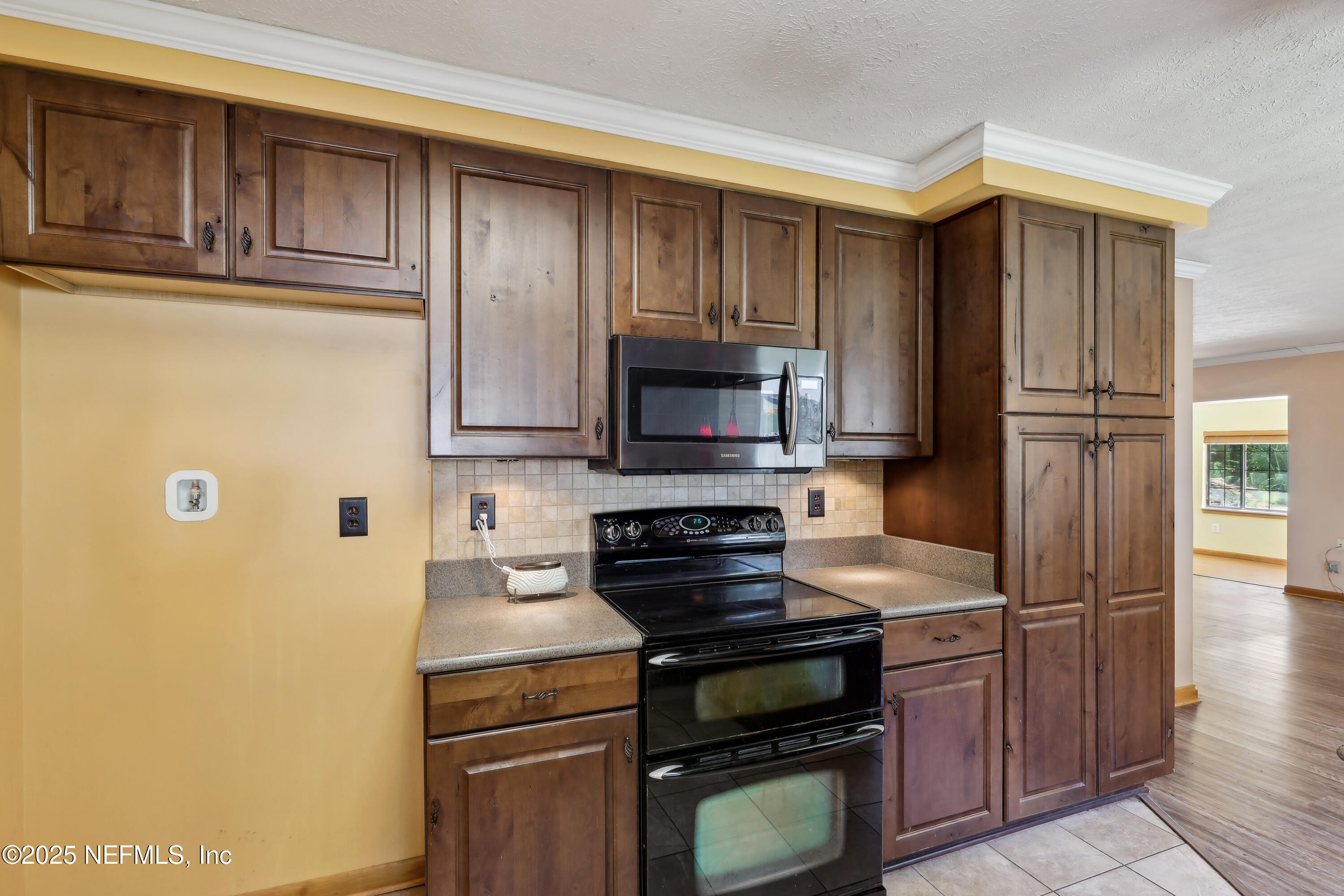 1071 Orangewood Road St. Johns, FL 32259 - Photo 21 of 56 a kitchen with stainless steel appliances granite countertop a refrigerator stove and sink