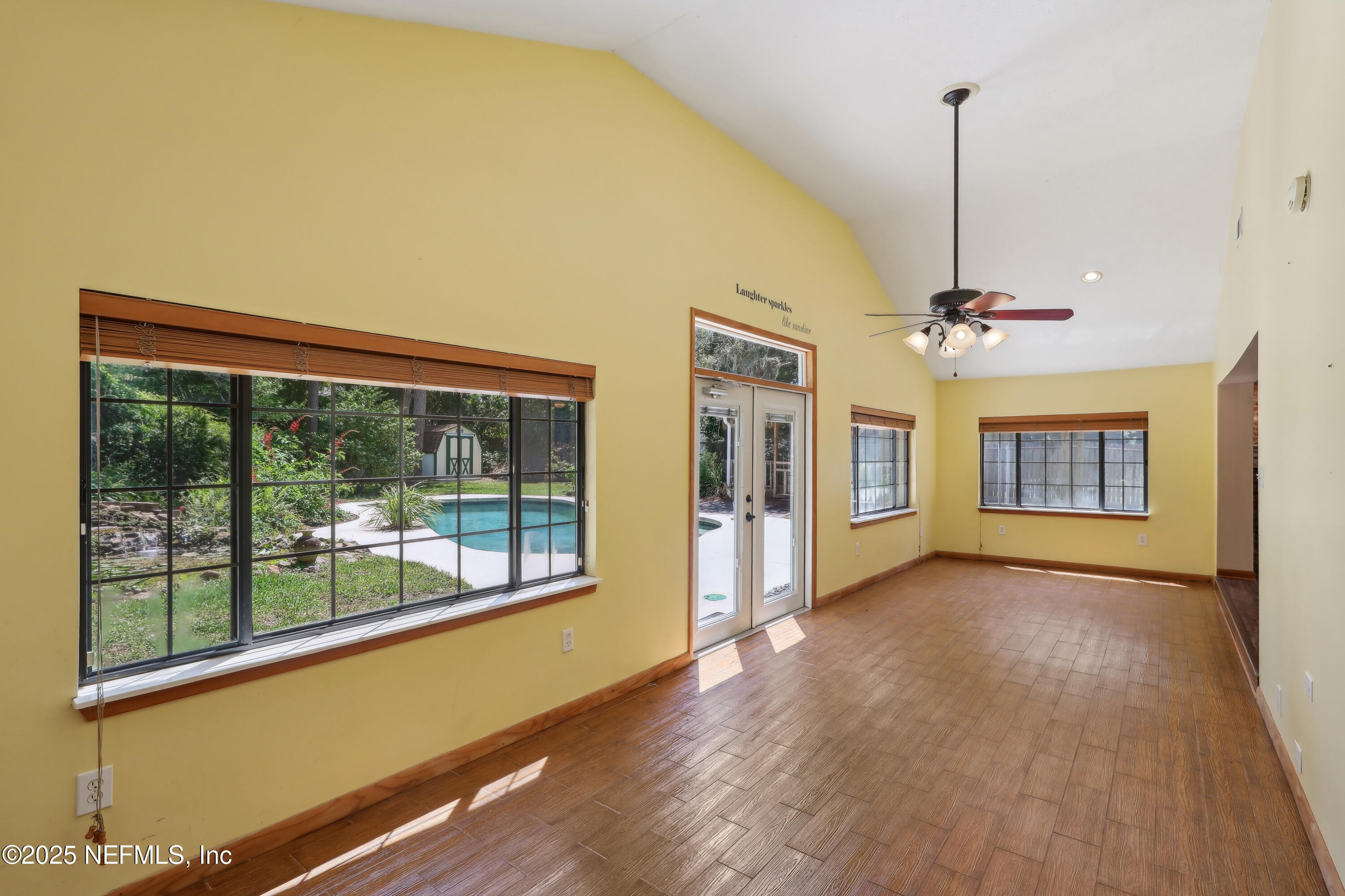 1071 Orangewood Road St. Johns, FL 32259 - Photo 27 of 56 a view of an empty room with a window and wooden floor