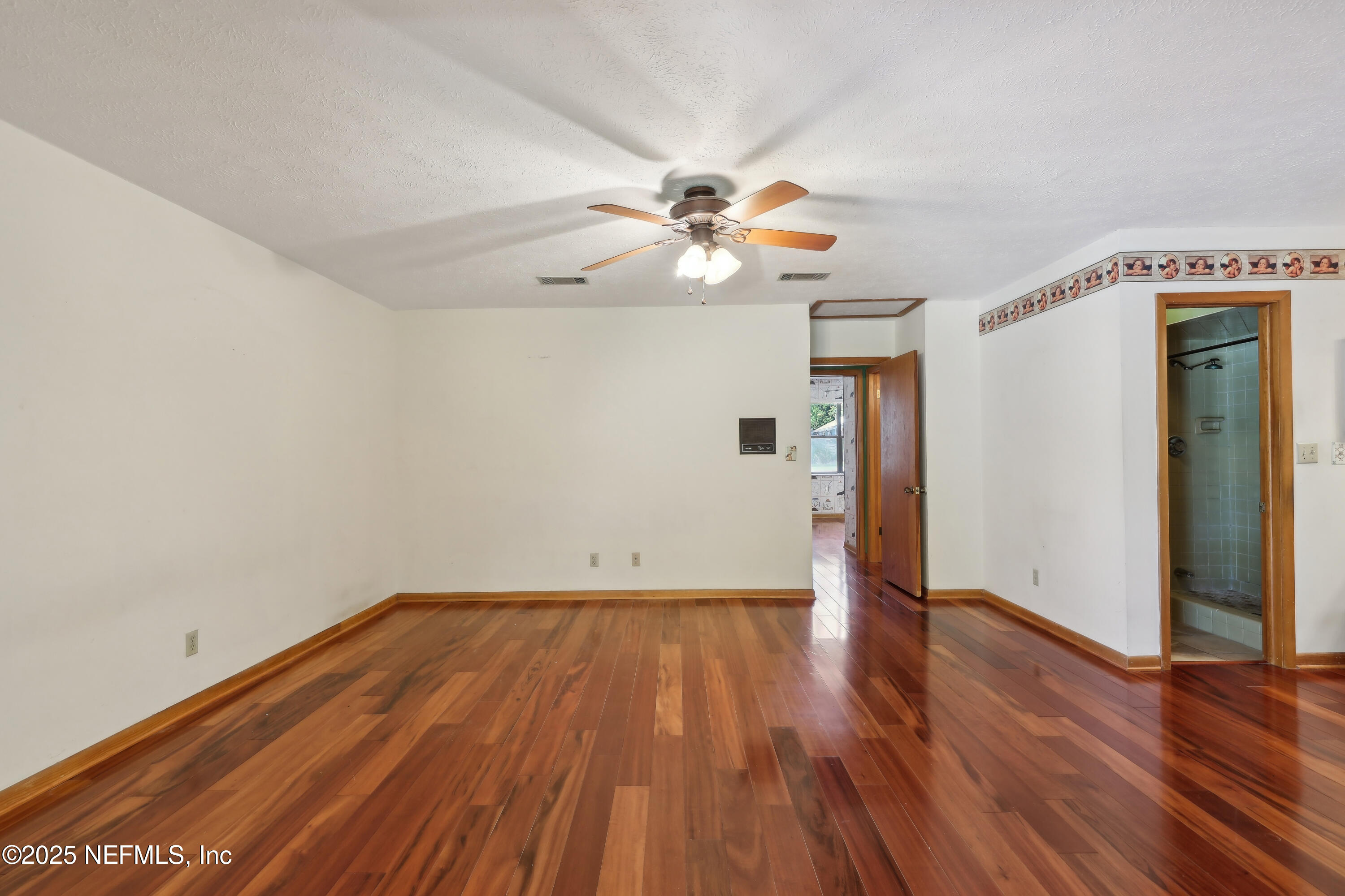 1071 Orangewood Road St. Johns, FL 32259 - Photo 29 of 56 a view of a big room with wooden floor and a ceiling fan