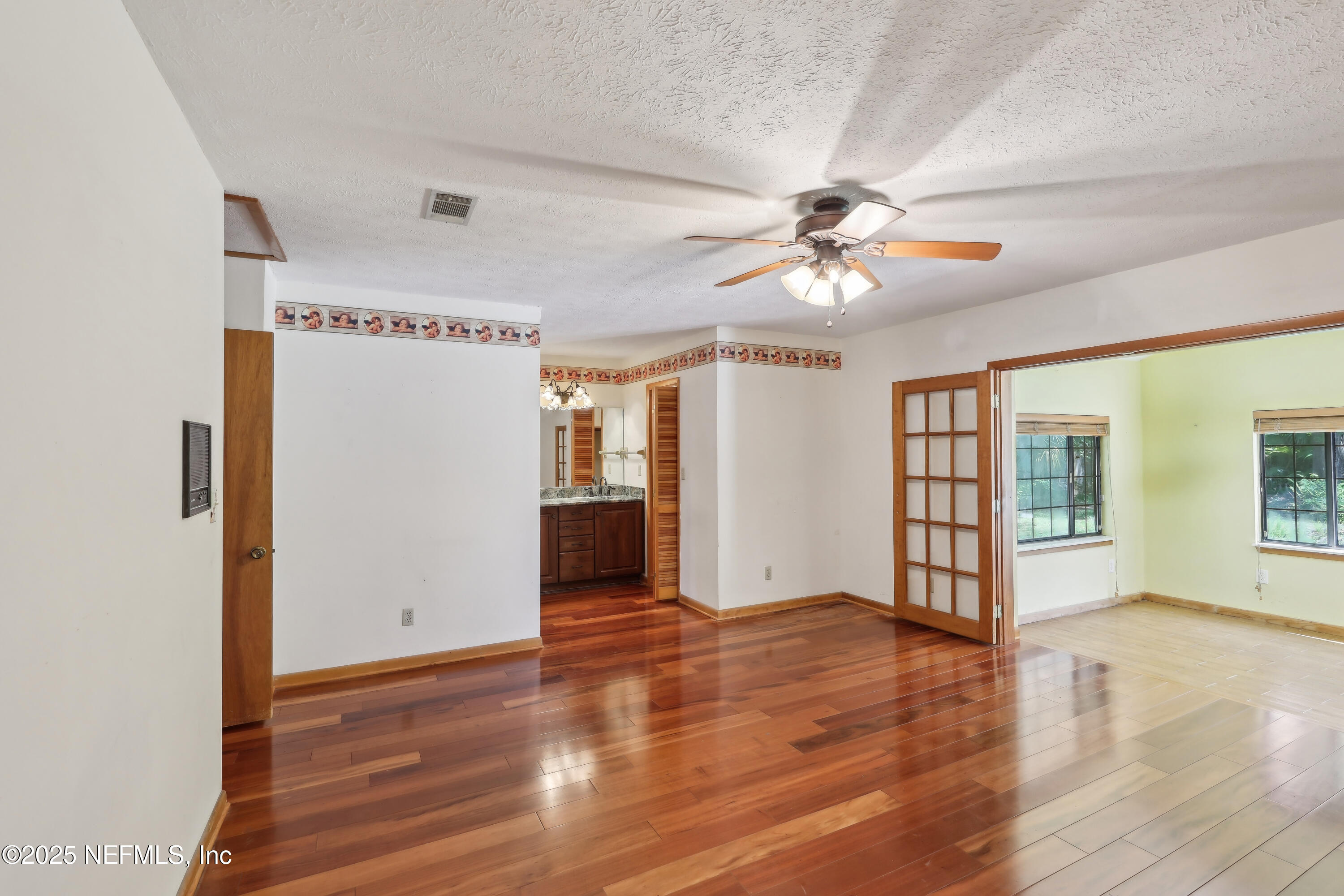 1071 Orangewood Road St. Johns, FL 32259 - Photo 30 of 56 a view of an empty room with window and wooden floor