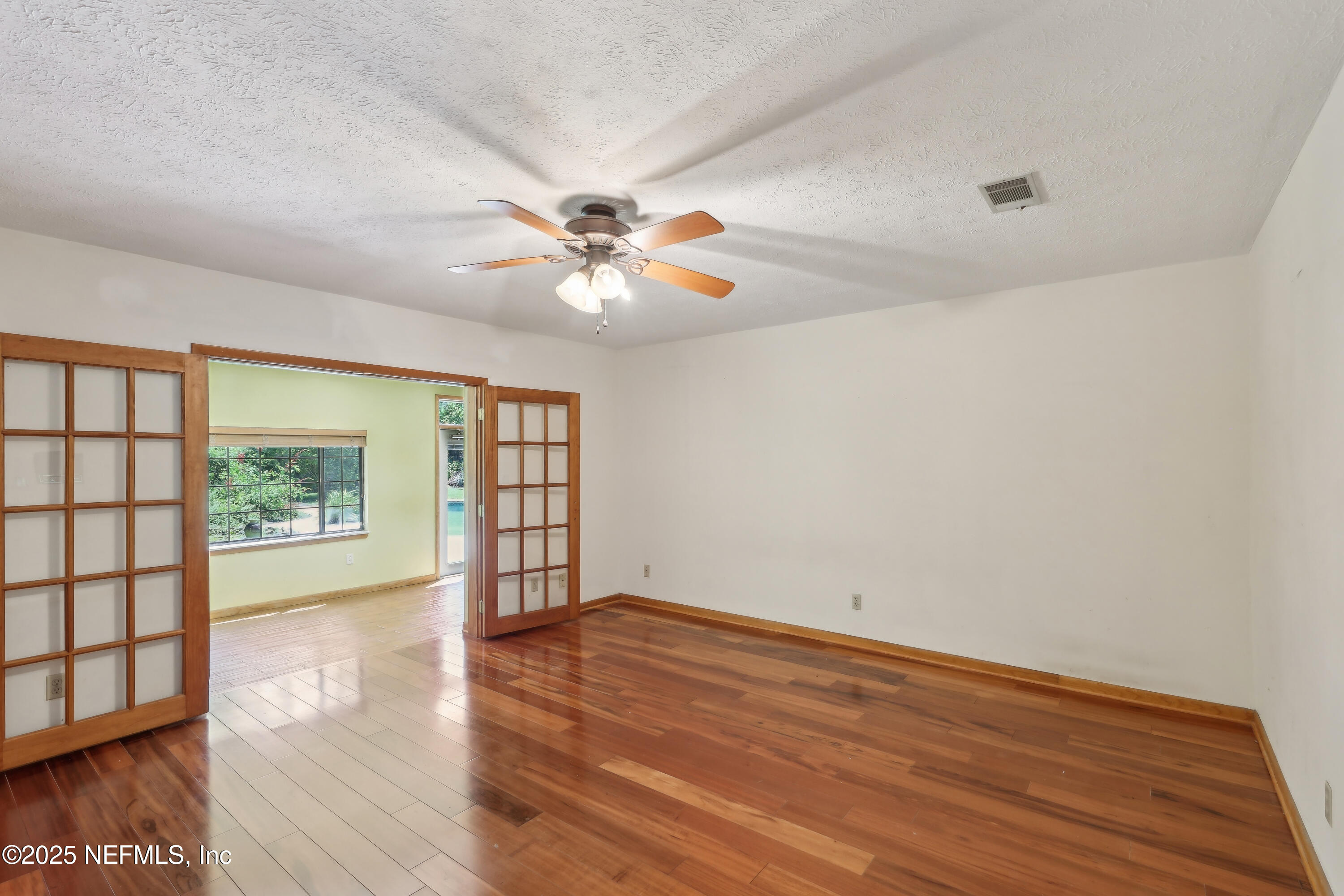 1071 Orangewood Road St. Johns, FL 32259 - Photo 31 of 56 wooden floor in an empty room with a window