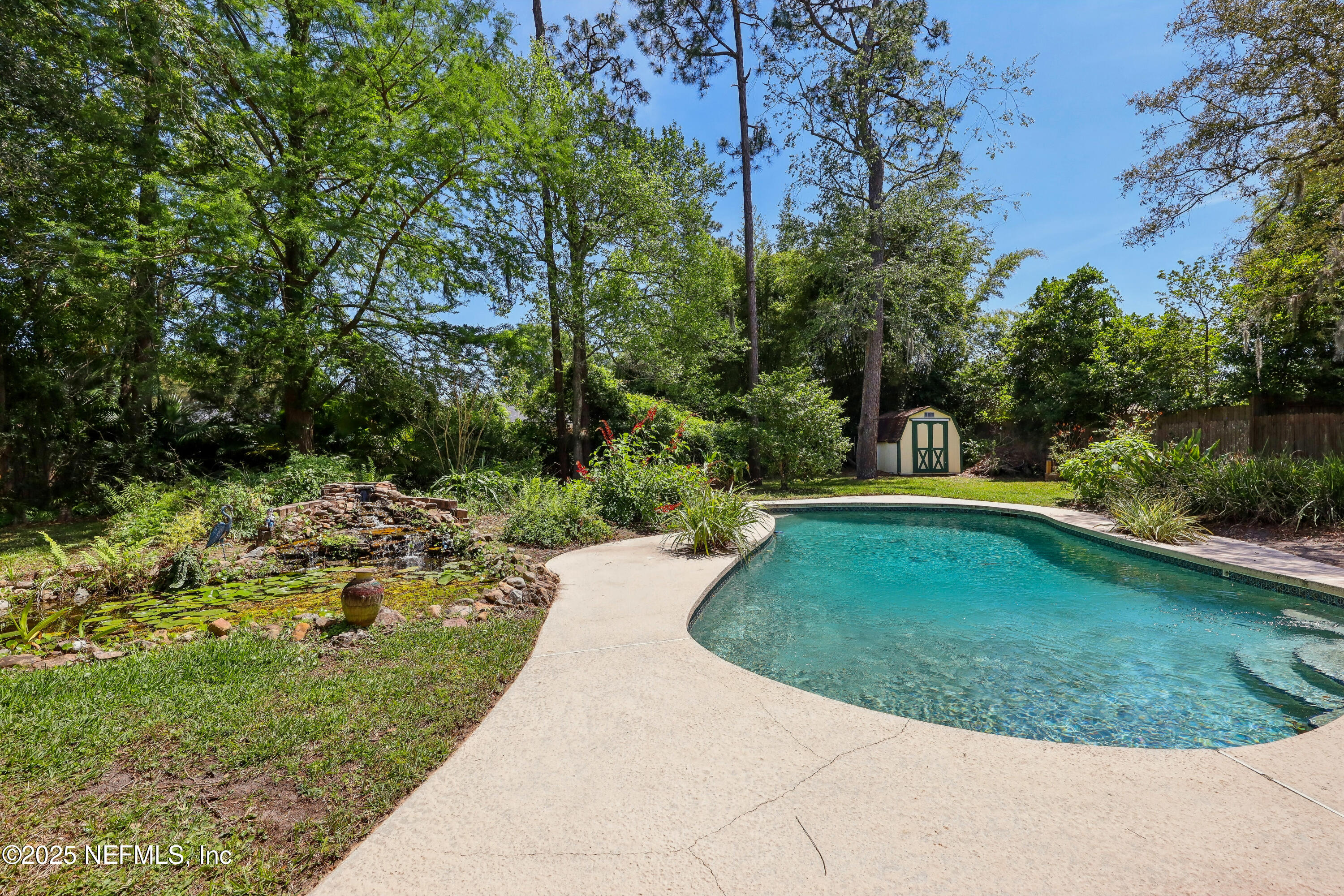 1071 Orangewood Road St. Johns, FL 32259 - Photo 39 of 56 a view of a swimming pool with a yard