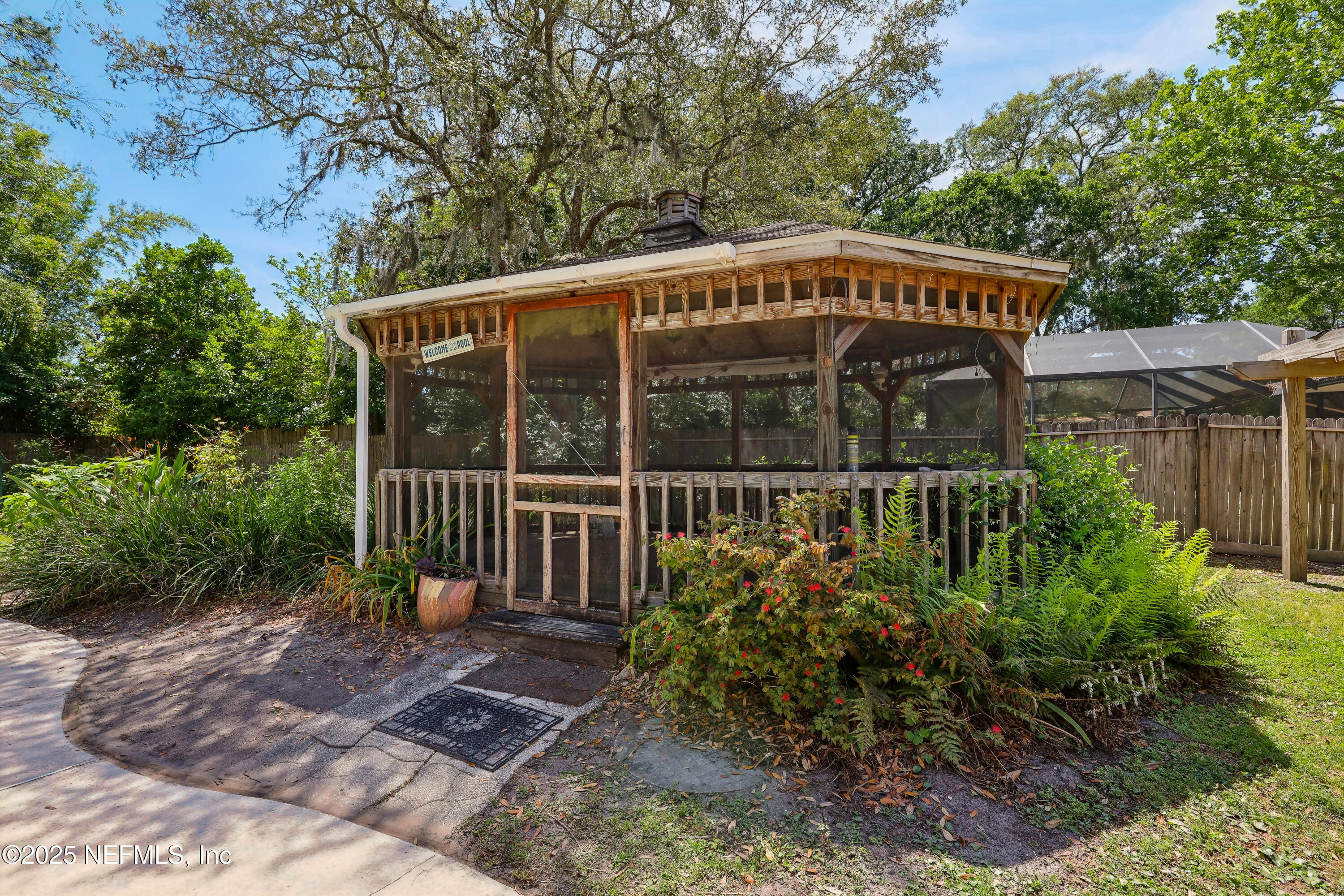 1071 Orangewood Road St. Johns, FL 32259 - Photo 43 of 56 a front view of a house with garden