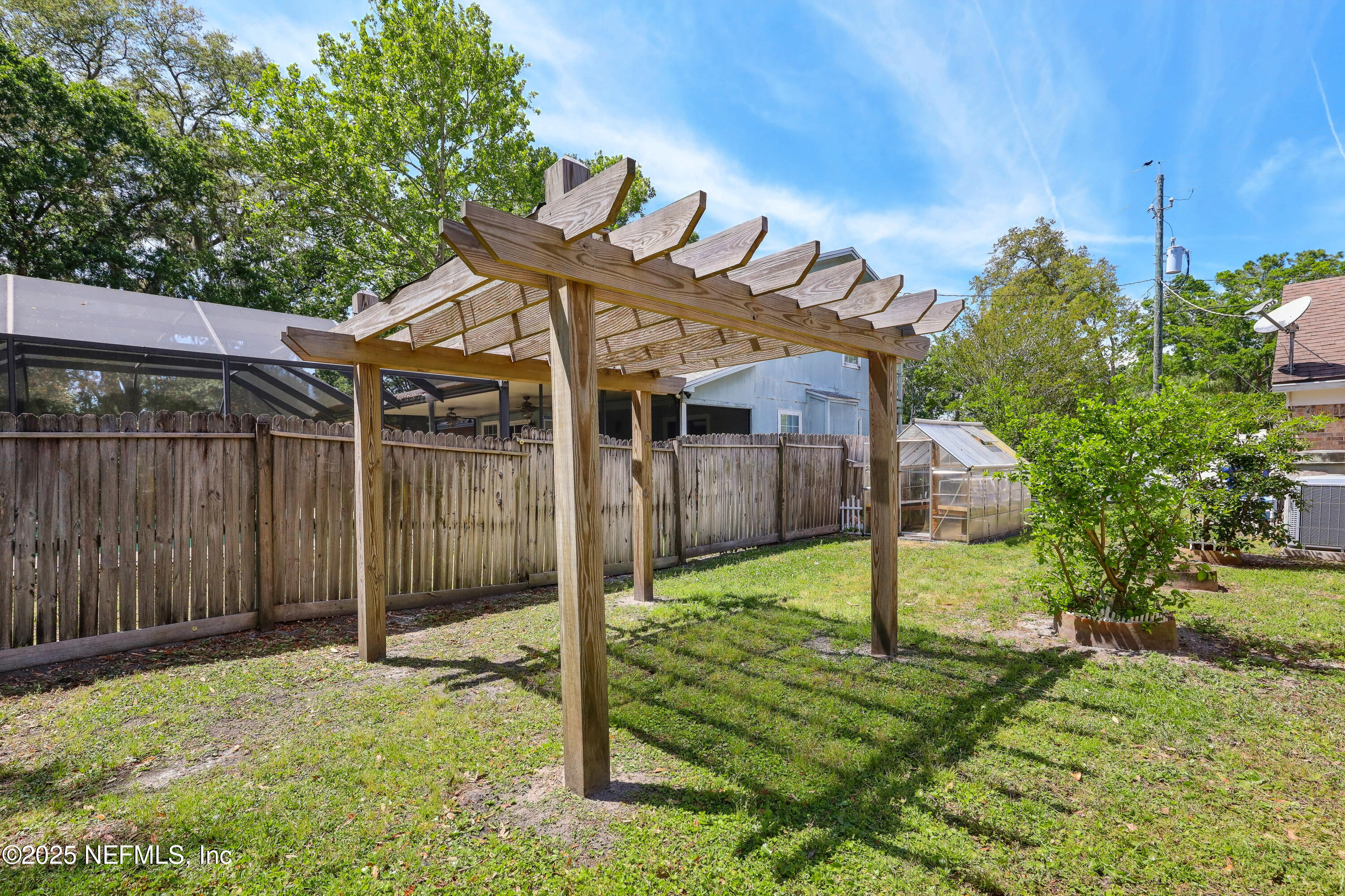 1071 Orangewood Road St. Johns, FL 32259 - Photo 45 of 56 a backyard of a house with table and chairs
